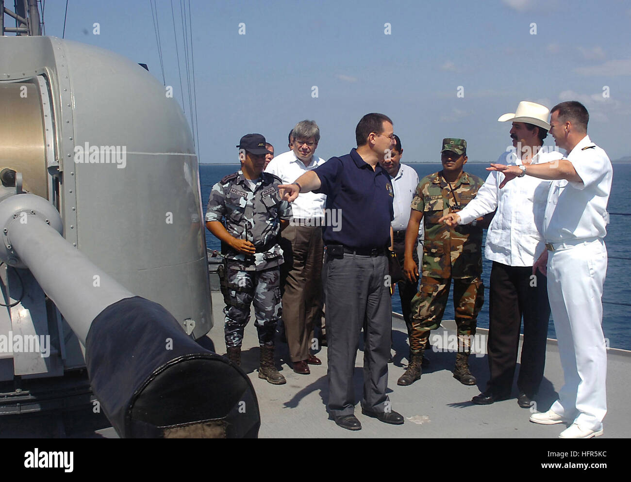 060504-N-2736O-008 Puerto Castilla, Honduras (May 4, 200) - Commanding officer USS Underwood (FFG 36), Cmdr. Roderick Fraser explains the operations of MK 75 rapid fire gun to the President of the Republic Honduras Jose Manuel Zelaya. President Zelaya toured Underwood and thanked the crew for their outstanding community relationÕs efforts in Honduras. Underwood is part of the George Washington Carrier Strike group participating in Partnership of the Americas, a maritime training and readiness deployment of the U.S. Naval Forces with Caribbean and Latin American countries in support of Southern Stock Photo