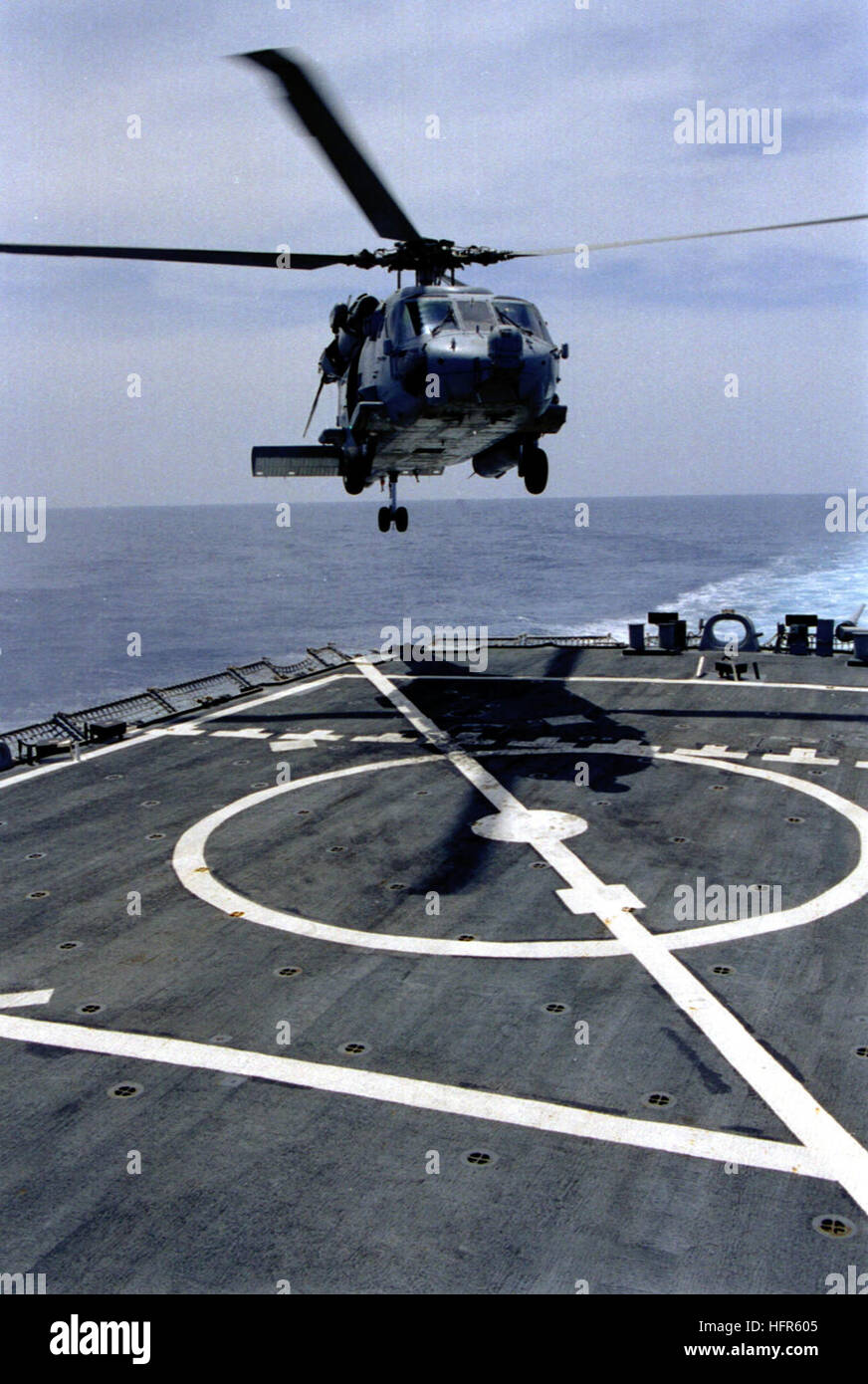 990608-N-8493H-001 At sea aboard USS Gonzalez (DDG 66) June 08,1999 -- An SH-60 'Seahawk' attached to Helicopter Squadron Three (HS-3) conducts deck landing qualifications (DLQ) aboard the USS Gonzalez.  USS Gonzalez, USS Theodore Roosevelt, and supporting airwing are operating in the Adriatic Sea in support of the NATO led Operation Allied Force.  U.S. Navy photo by PhotographerÕs Mate 2nd Class Steven Harbour. (RELEASED) US Navy 990608-N-8493H-001 SH-60 Seahawk conducts deck landing qualifications Stock Photo