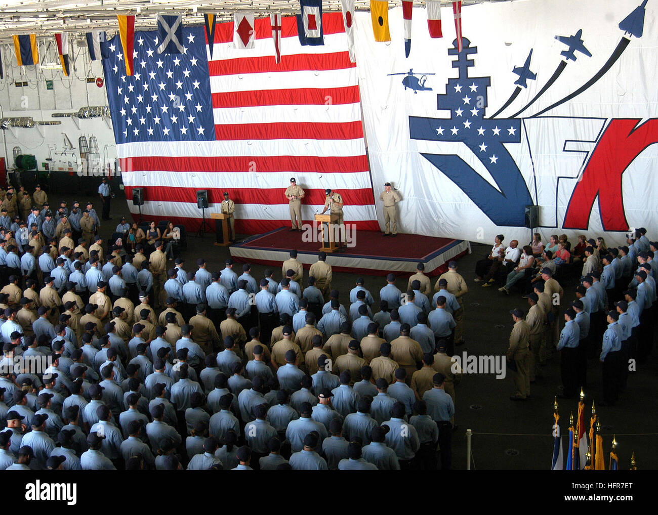 060608-N-6155A-001 Mayport, Fla. (June 8, 2006) - Commanding Officer USS John F. Kennedy (CV 67), Capt. Todd A. Zecchin, congratulates 178 Sailors on their promotion to the next higher pay grade as all hands observe the advancement ceremony aboard the conventionally-powered aircraft carrier. The frockees also received congratulations from friends and family members present at the event. Through an aggressive study program, 59 more Kennedy Sailors advanced during this advancement cycle compared to the previous cycle. U.S. Navy photo by PhotographerÕs Mate Airman Nathan Anderson (RELEASED) US Na Stock Photo