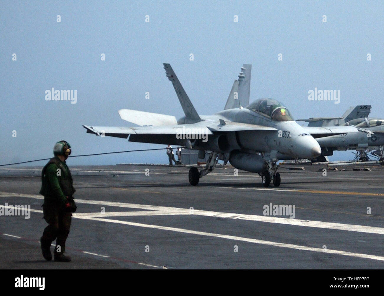060608-N-1121F-009 June 8, 2006 Aboard USS Theodore Roosevelt (CVN-71)  A F/A-18 catches the wire after landing while conducting flight operations underway. U.S. Navy Photo by Photographer's Mate 3rd Class   Jacob Fadley US Navy 060608-N-1121F-009 An F-A-18C Hornet conducts an arrested landing aboard the Nimitz-class aircraft carrier USS Theodore Roosevelt (CVN 71) Stock Photo