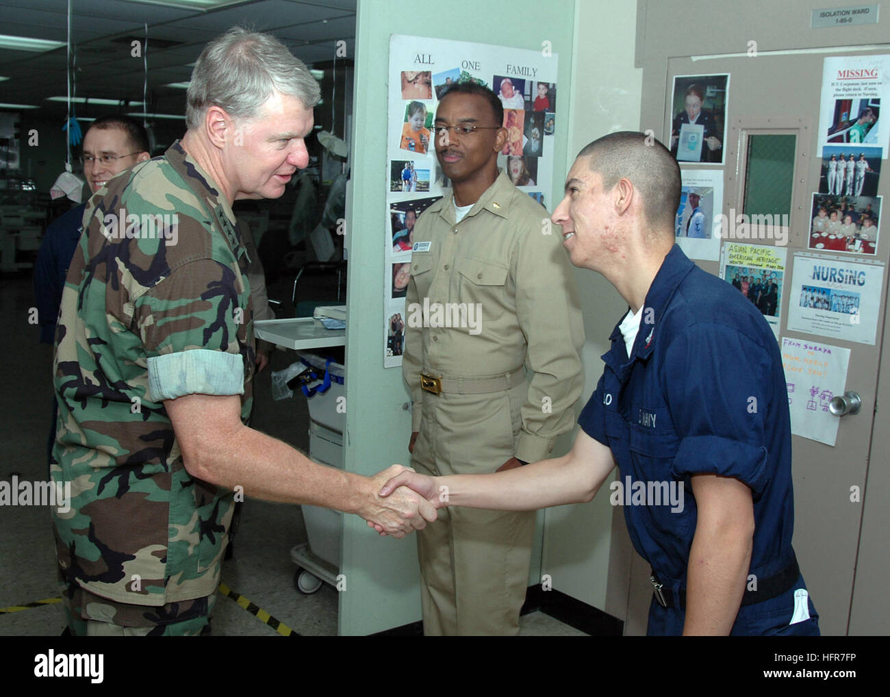 060608-N-3931M-109 Jolo, Philippines (June 8, 2006) - Commander, U.S. Pacific Fleet Adm. Gary Roughead, greets Navy Hospital Corpsman 3rd Class Duane Sedillo, a Pueblo, Colo., native of the Medical Treatment Facility aboard the U.S. Military Sealift Command (MSC) Hospital ship USNS Mercy (T-AH 19), during a tour while the ship visits the city on a scheduled humanitarian mission. Mercy is on a five-month humanitarian assistance deployment to South and Southeast Asia, and the Pacific Islands. Mercy is uniquely capable of supporting medical and humanitarian assistance needs and is configured with Stock Photo