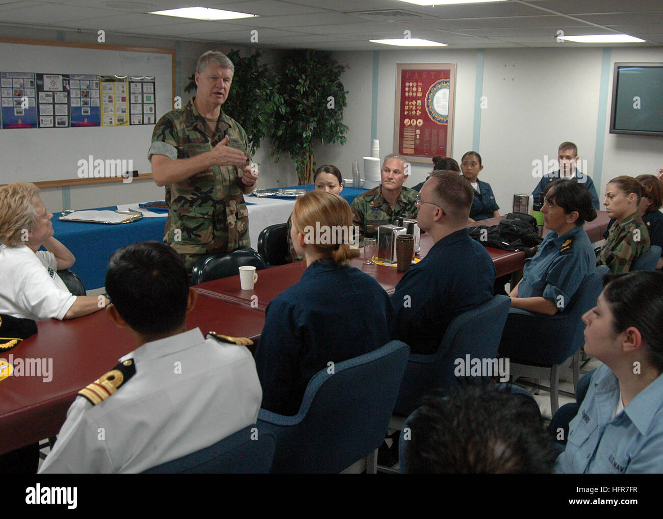 060608-N-3931M-144 Jolo, Philippines (June 8, 2006) Commander, U.S. Pacific Fleet Adm. Gary Roughead, talks with members of the Medical Treatment Facility during a tour aboard the U.S. Military Sealift Command (MSC) Hospital ship USNS Mercy (T-AH 19) while the ship visits the city on a scheduled humanitarian mission. Mercy is on a five-month humanitarian assistance deployment to South and Southeast Asia, and the Pacific Islands. Mercy is uniquely capable of supporting medical and humanitarian assistance needs and is configured with special medical equipment and a robust multi-specialized medic Stock Photo