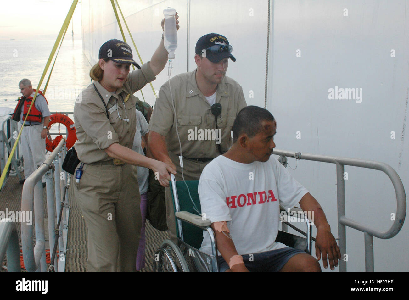 060611-N-9076B-048  Tawi-Tawi, Philippines (June 11, 2006) - A recent car accident victim is brought out to the U.S. Military Sealift Command (MSC) Hospital Ship USNS Mercy (T-AH 19), while the ship is anchored of the coast of Tawi-Tawi. The Mercy has already visited Zamboanga and Jolo, Philippines, where its crew had treated several thousand patients. The ship will bring patients aboard where its doctors will perform major surgeries to remove goiters and cataracts as well as repair cleft lips. Ashore, teams of doctors, nurses and corpsmen spend their time providing aid to patients not requiri Stock Photo