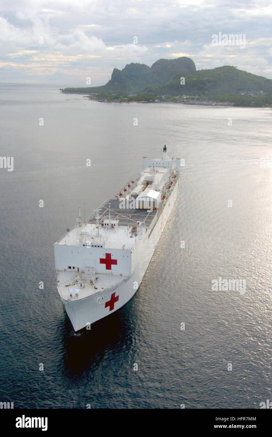 060614-N-6501M-003 Tawi Tawi, Philippines (June 14, 2006) - The U.S. Military Sealift Command (MSC) Hospital Ship USNS Mercy (T-AH 19) is anchored off of the coast of Tawi Tawi, while providing a multitude of medical and dental care for the people who live in this region of the South Philippines. The medical crew aboard Mercy will provide general and ophthalmology surgery, basic medical evaluation and treatment, preventive medicine treatment, dental screenings and treatment, optometry screenings, eyewear distribution, public health training and veterinary services as requested by the host nati Stock Photo