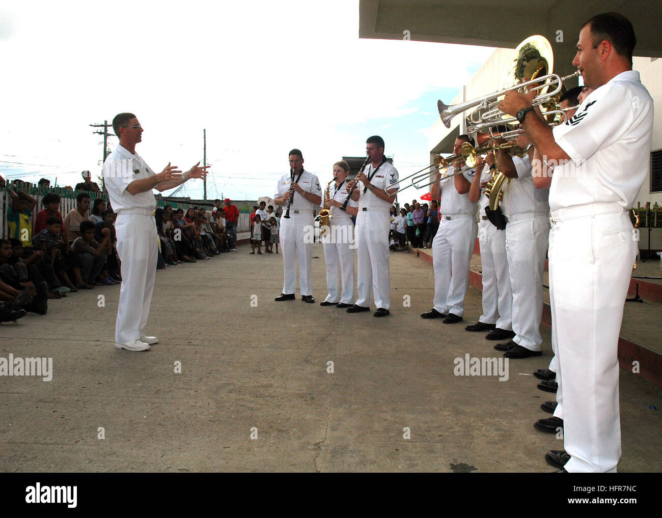60612-N-3931M-049 Tawi Tawi, Philippines (June 12, 2006) - U.S. Navy Showband Sailors embarked aboard the U.S. Military Sealift Command (MSC) Hospital Ship USNS Mercy (T-AH 19), perform for local residents at the Datu Halun Sakilan Memorial Hospital, while the ship visits the city on a scheduled humanitarian mission. The Mercy has already visited Zamboanga and Jolo, Philippines, where its crew had treated several thousand patients. The ship will bring patients aboard where its doctors will perform major surgeries to remove goiters and cataracts as well as repair cleft lips. Ashore, teams of do Stock Photo