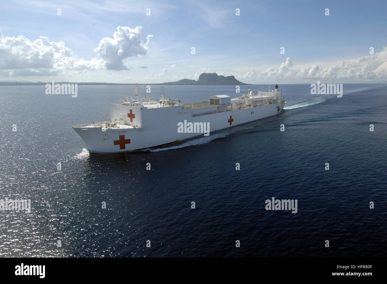 060618-N-6501M-008 Tawi-Tawi, Philippines (June 18, 2006) - The U.S. Military Sealift Command (MSC) Hospital Ship USNS Mercy (T-AH 19) sets sail for Sembawang, Singapore, after its four-week stay in the South Philippines. Mercy is on a five-month deployment to South Asia, Southeast Asia, and the Pacific Islands. The medical crew aboard Mercy will provide general and ophthalmology surgery, basic medical evaluation and treatment, preventive medicine treatment, dental screenings and treatment, optometry screenings, eyewear distribution, public health training and veterinary services as requested  Stock Photo