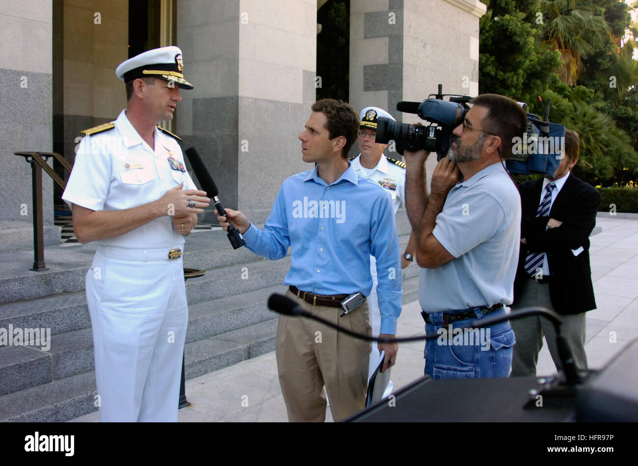 060823-N-6843I-124 Sacramento, Calif. (Aug. 23, 2006) - Commander, Navy Region Southwest Rear Adm. Len R. Hering Sr. speaks to reporters during a press conference for assembly bill (AB) 1965 at the California State Capitol building. AB 1965 is a proposal to help stop predatory lending practices such as charging service members high interest rates on short-term loans. A survey by the Defense Manpower Data Center showed that 13 percent of Sailors have used predatory loans in the last 12 months, where interest rates can exceed 1,000 percent and cost military members and their families more than $ Stock Photo