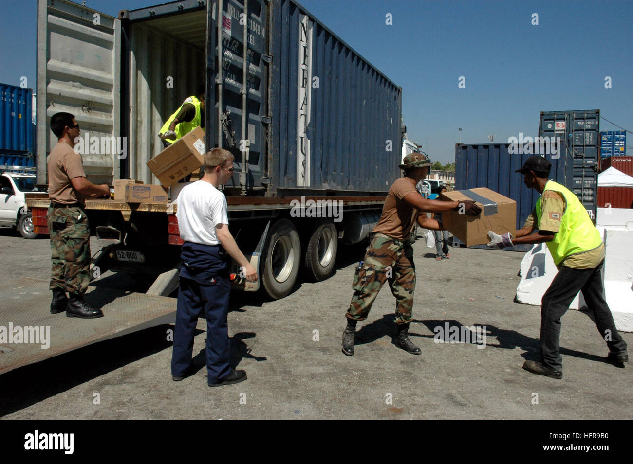 060828-N-3714J-046 Dili, Timor Leste (Aug. 28, 2006) - Members embarked with the Medical Treatment Facility aboard the Military Sealift Command hospital ship USNS Mercy (T-AH 19), help load a truck with medical supplies donated to a local hospital. Mercy is anchored off the coast to provide humanitarian, medical and civic assistance to Dili residents. Mercy is in the fourth month of her five-month humanitarian and civic assistance deployment to South and Southeast Asia where her crew has already treated thousands of people. MercyÕs mission is being carried out by volunteers from Project HOPE a Stock Photo