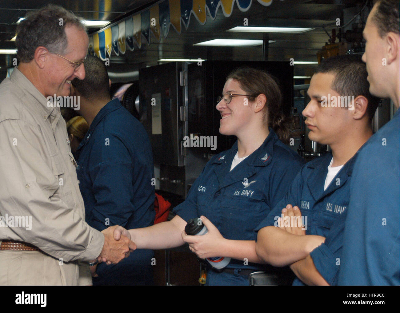 060827-N-5642P-008  Caribbean Sea (Aug. 27, 2006) - Congressman Mike Conaway-(R), 11th Congressional District of Texas, meets and greets crew members aboard the amphibious assault ship USS Kearsarge (LHD 3) during exercise PANAMAX 2006. Rep. Conaway was aboard Kearsarge to observe operations while participating in PANAMAX 2006, a multi-national exercise tailored to training civil and military forces for interoperability in support of the Government of Panama to protect and guarantee safe passage through the Panama Canal. U.S. Navy photo By Mass Communication Specialist Seaman William S. Parker Stock Photo