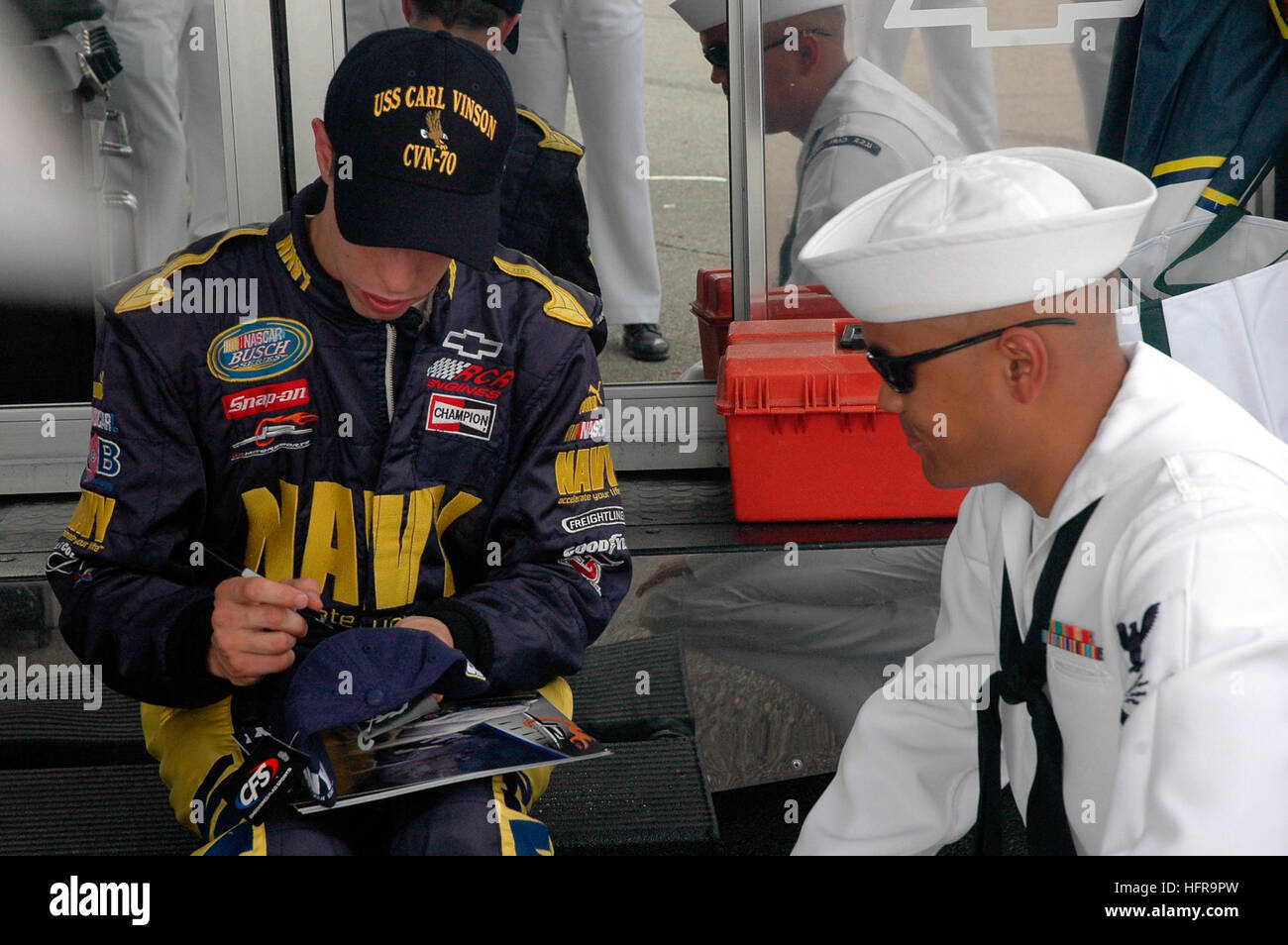 070728-N-3705H-186  INDIANAPOLIS (July 28, 2007) - Navy NASCAR team driver, Brad Keselowski, signs an autograph for a Sailor assigned to Nimitz-Class aircraft carrier USS Carl Vinson (CVN 70) during a meet-and-greet session before the Kroger 200 Busch Series race at O'Reilly Raceway Park. Seven Vinson Sailors attended the race to cheer on the No. 88 Navy Chevy Monte Carlo. U.S. Navy photo by Mass Communication Specialist Nina Hughes (RELEASED) US Navy 070728-N-3705H-186 Navy NASCAR team driver, Brad Keselowski, signs an autograph for a Sailor assigned to Nimitz-Class aircraft carrier USS Carl  Stock Photo