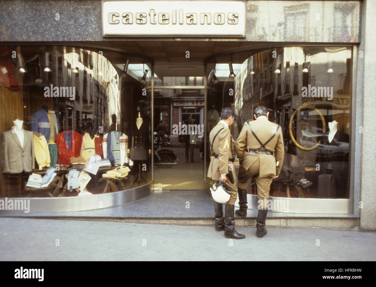 Madrid  motorcycle police officers looking at clothes in a shop window during a break Stock Photo