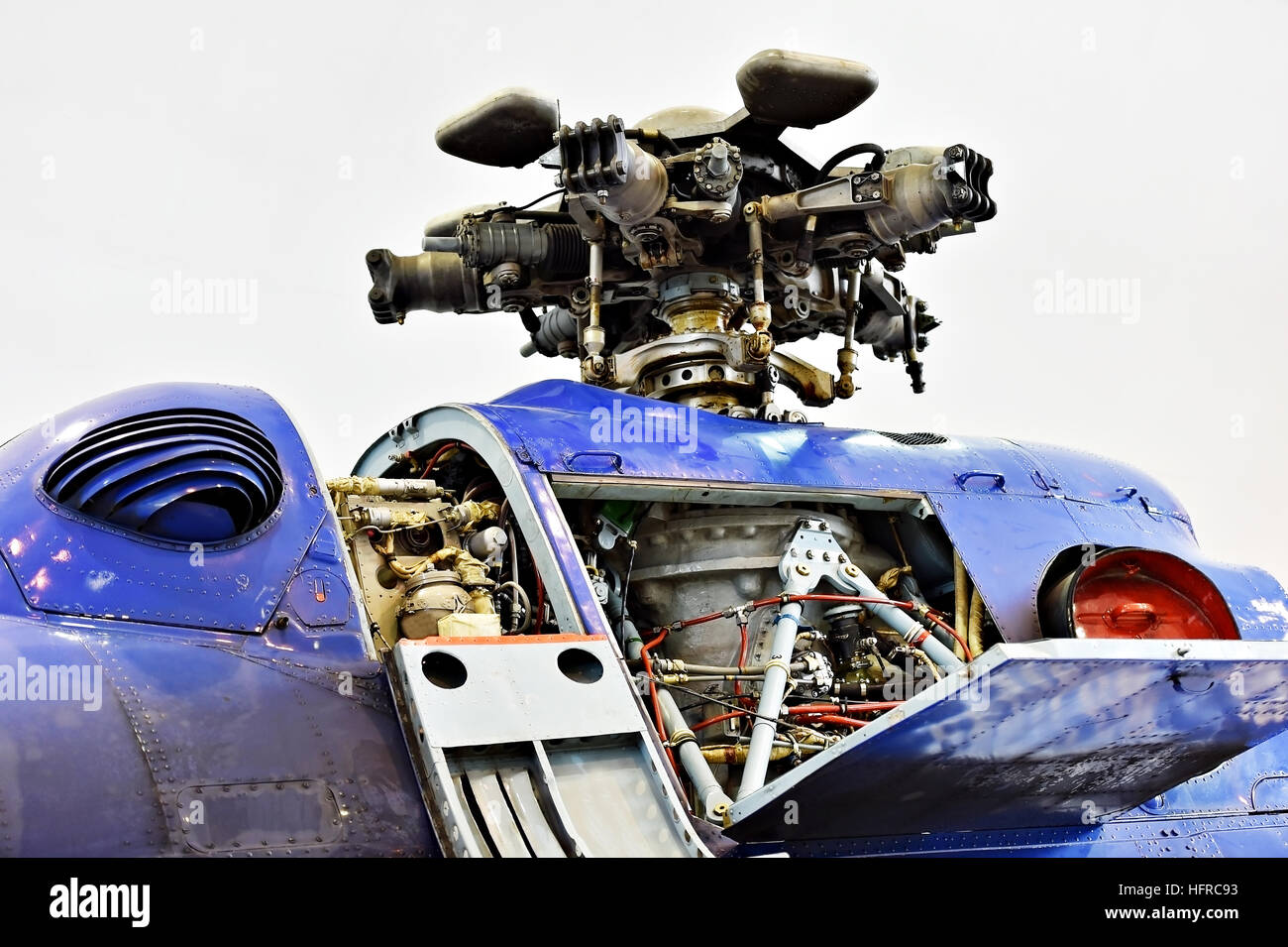 Detail with helicopter fuselage and rotor blade system on repair line