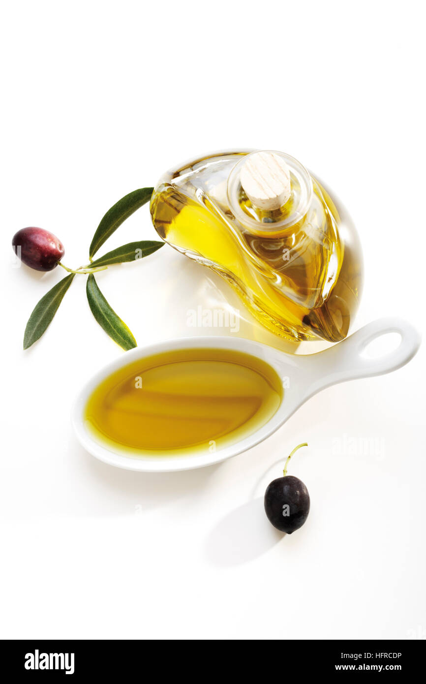 Bottle and spoonful of olive oil Stock Photo Alamy