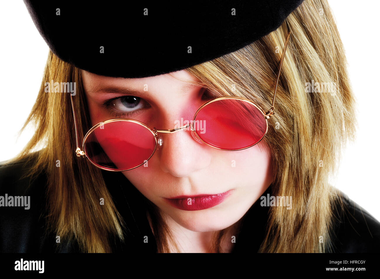 Girl wearing beret and rose-coloured glasses Stock Photo