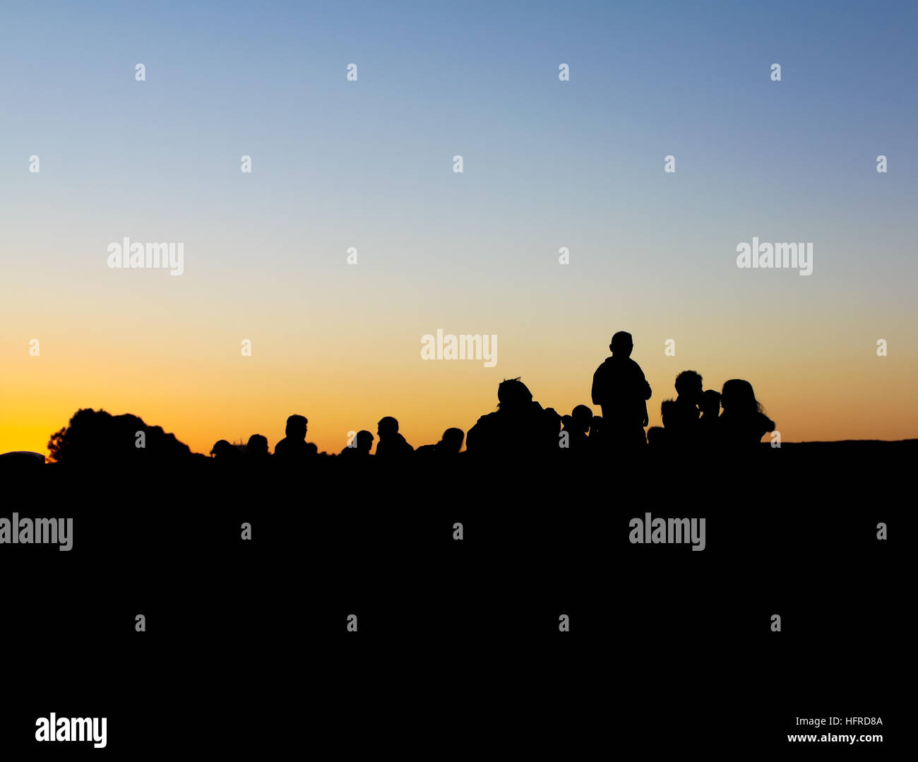 People silhouette against sunset Stock Photo - Alamy