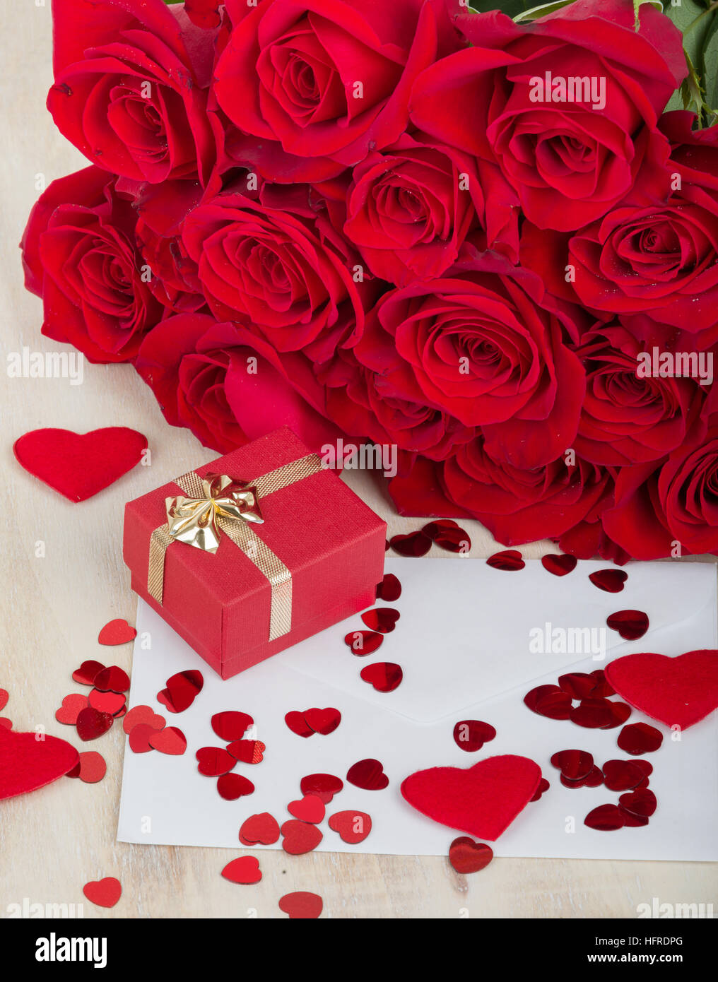 Valentine Gift With Bouquet Of Fresh Red Roses And Small Red Hearts Love Concept Stock Photo Alamy