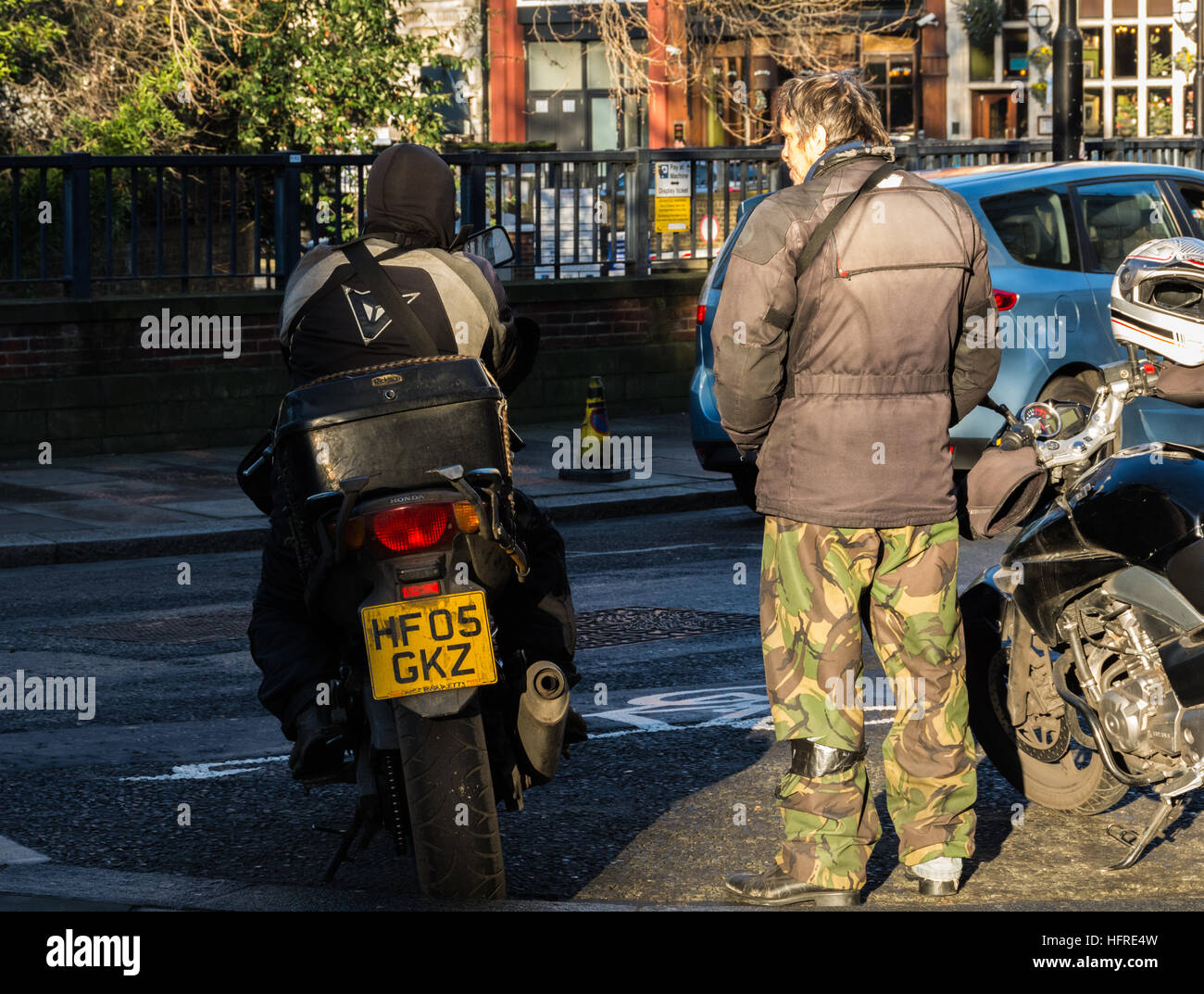 Two dispatch riders waiting for their next job in West Smithfield, London, UK Stock Photo