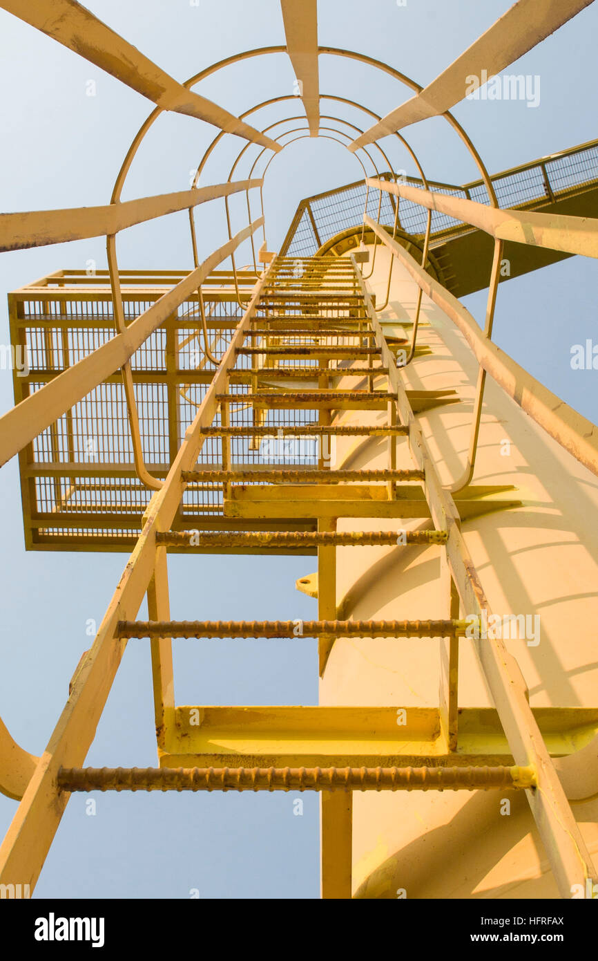 Looking up a ladder leading to the top of a crane Stock Photo Alamy