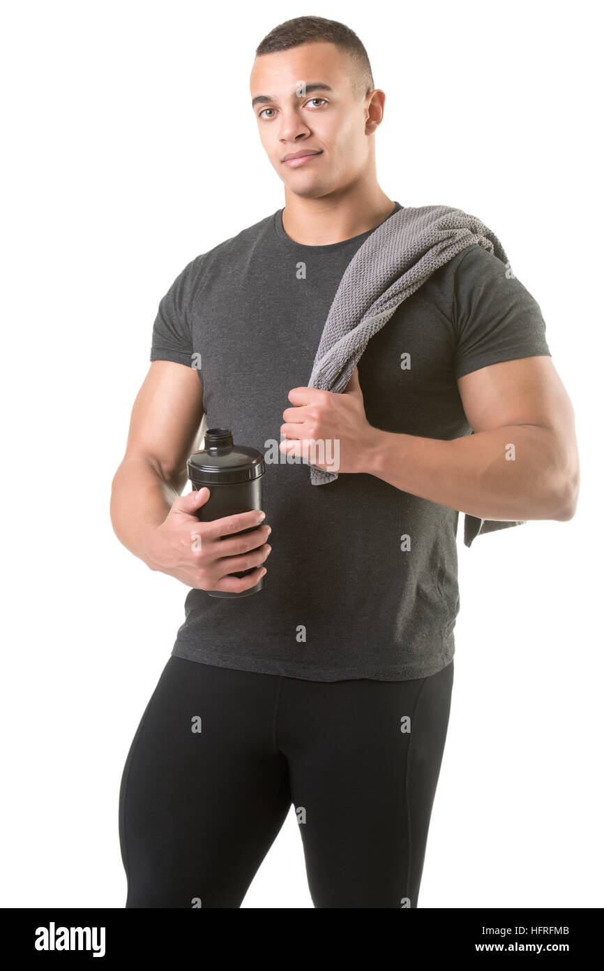 Man holding a protein shake after a workout in the gym, isolated in white Stock Photo