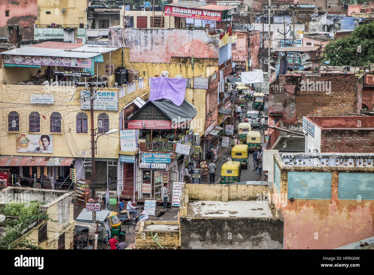 A crowded cityscape in Agra, India, with numerous auto rickshaws (tuk tuks). Stock Photo