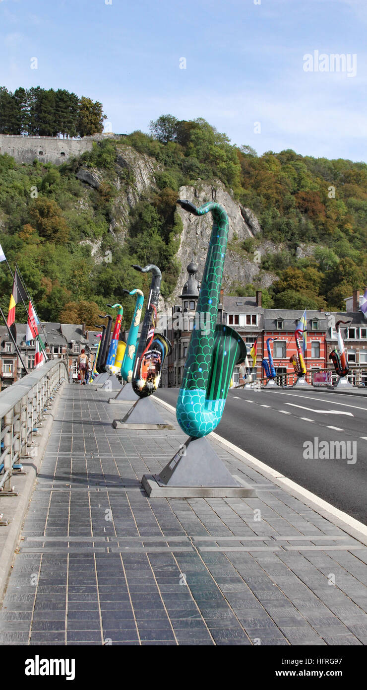Dinant is the home town of Adolphe Sax, inventor of the Saxophone. Replicas of saxophones line the bridge over the Meuse River Stock Photo