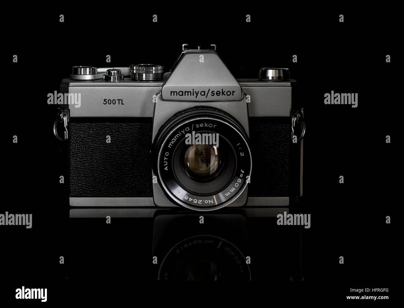 Old 35mm Mamiya / Sekor Film Camera on a black background Stock Photo