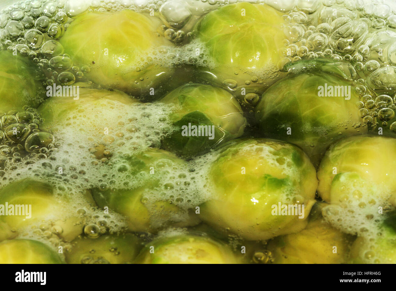 Brussel sprouts cooking in boiling water. Stock Photo