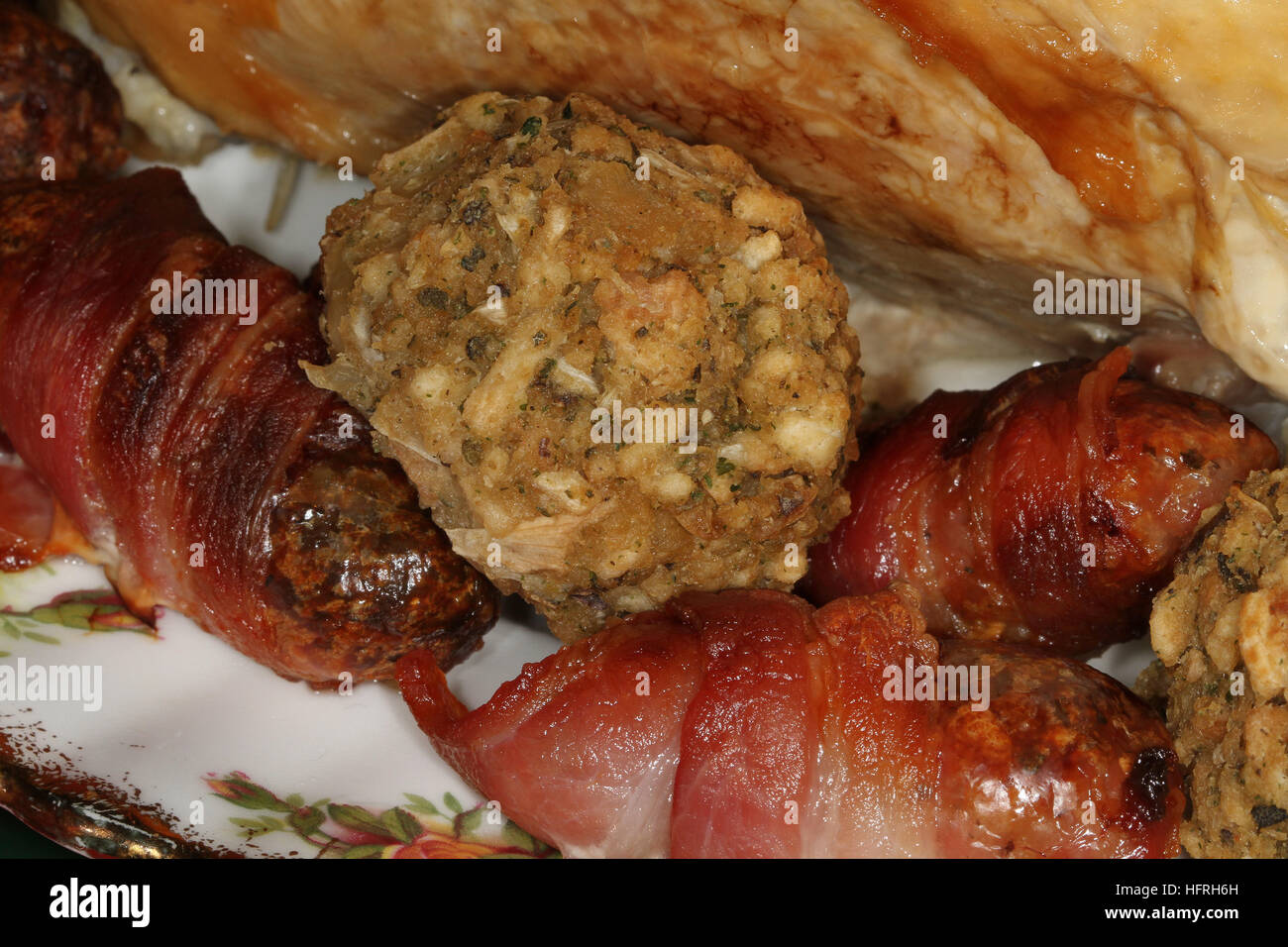Sausages, bacon and stuffing. Christmas fare in the kitchen. Stock Photo
