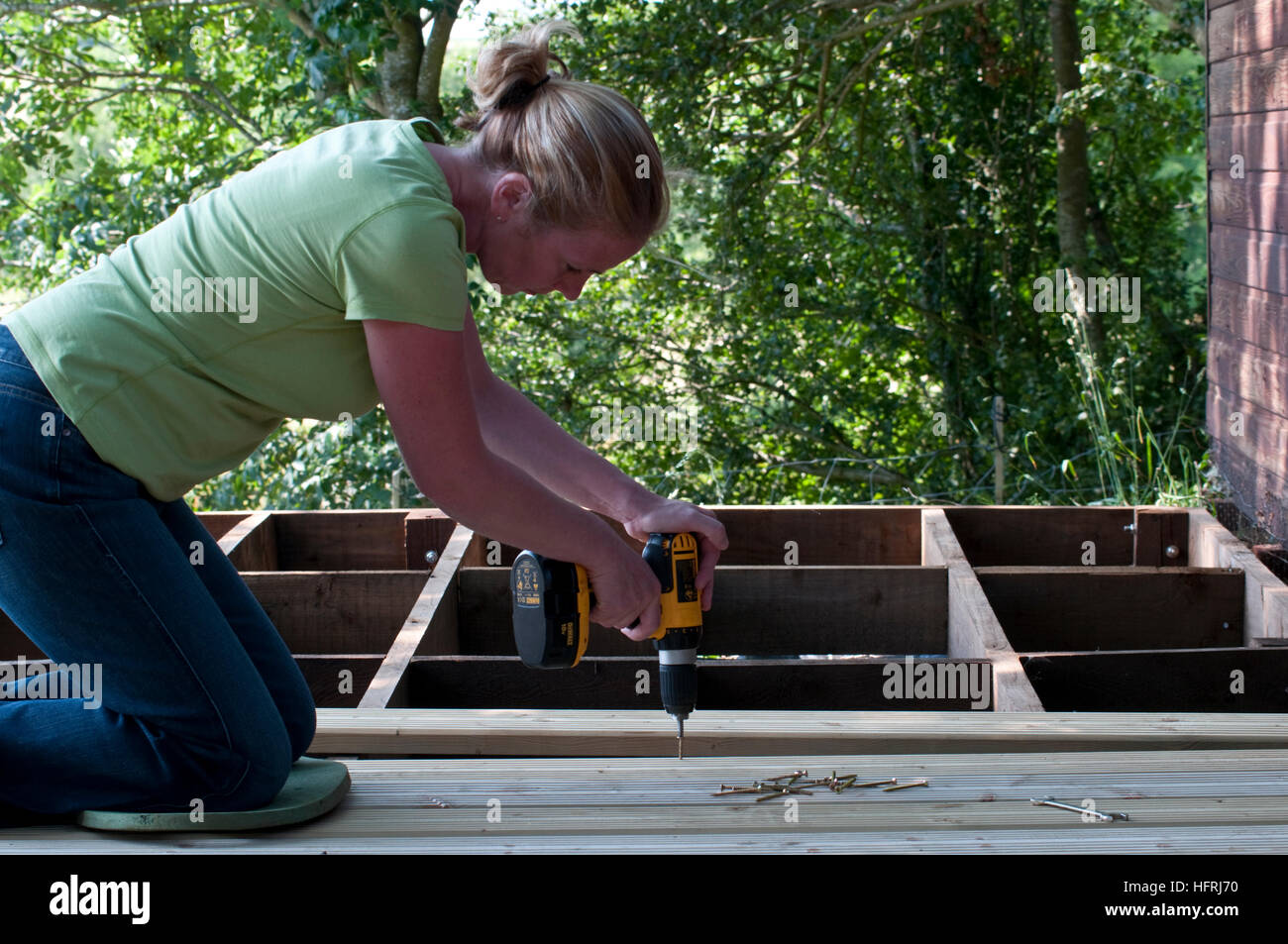 Attaching deck boards to joists Stock Photo Alamy