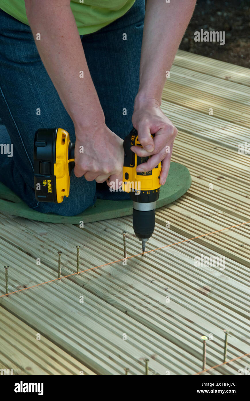 Attaching deck boards to joists Stock Photo Alamy