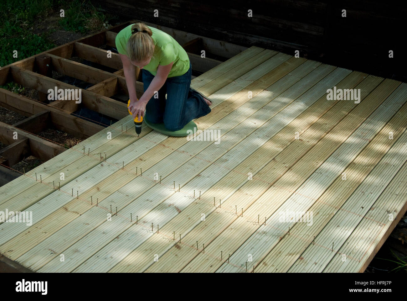 Attaching deck boards to joists Stock Photo Alamy