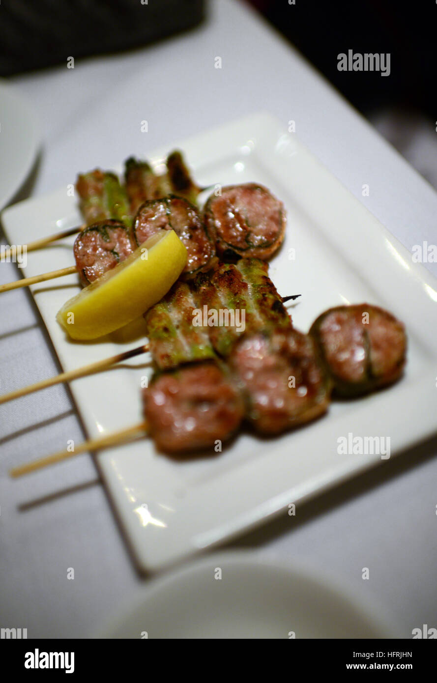 Pork sausage wrapped in shiso leaf, asparagus wrapped in pork skin at