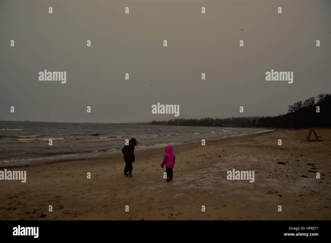 Girls at the beach in winter Stock Photo