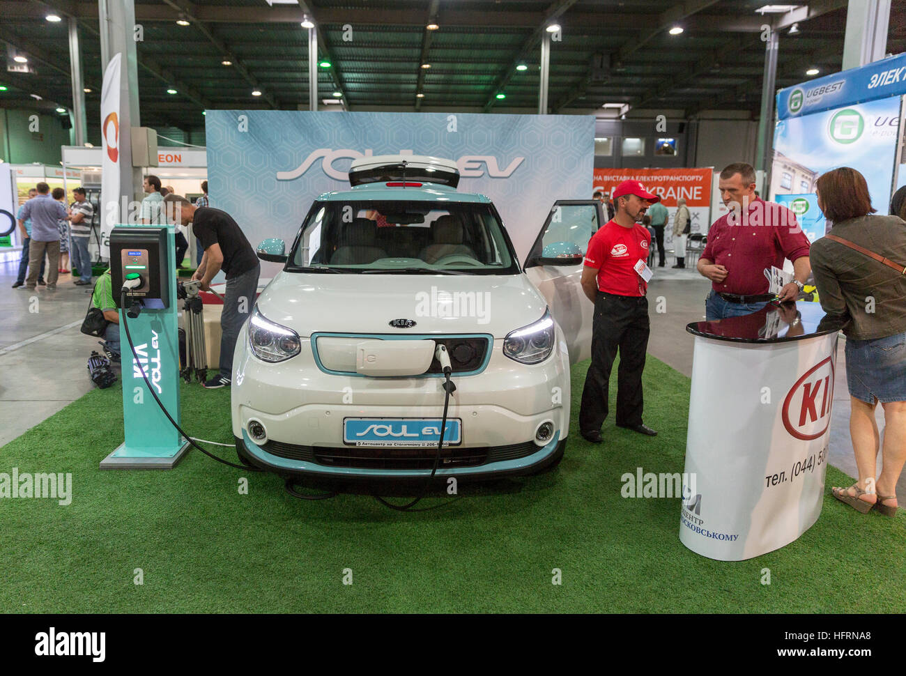 Unrecognized visitors visit Kia Soul EV electric vehicle booth at First