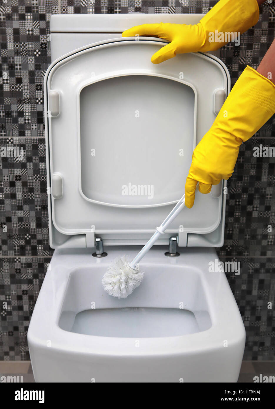 cleaning of toilet bowl in yellow rubber gloves Stock Photo Alamy