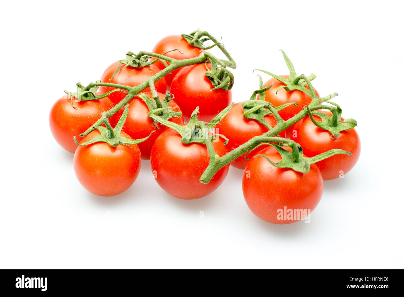 Fresh cherry tomatoes on the vine on a white background Stock Photo - Alamy