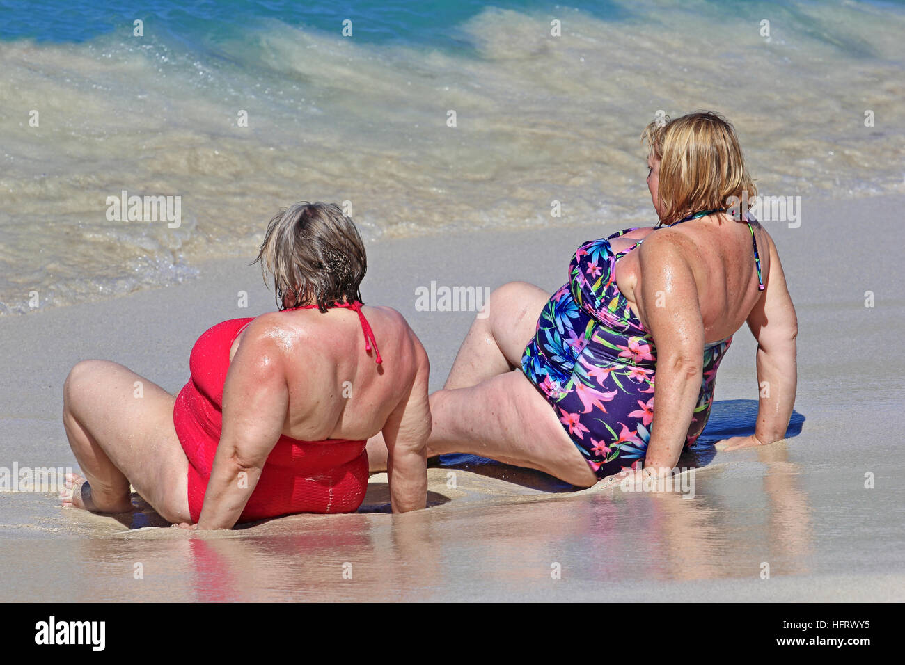 Two middle aged ladies at on beach Stock Photo