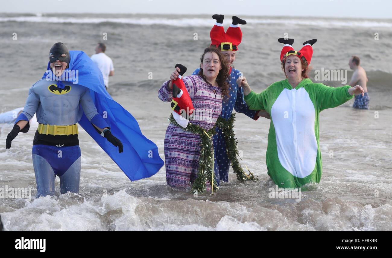 Swimmers take part in a New Year's Day dip in the North Sea at Whitley ...
