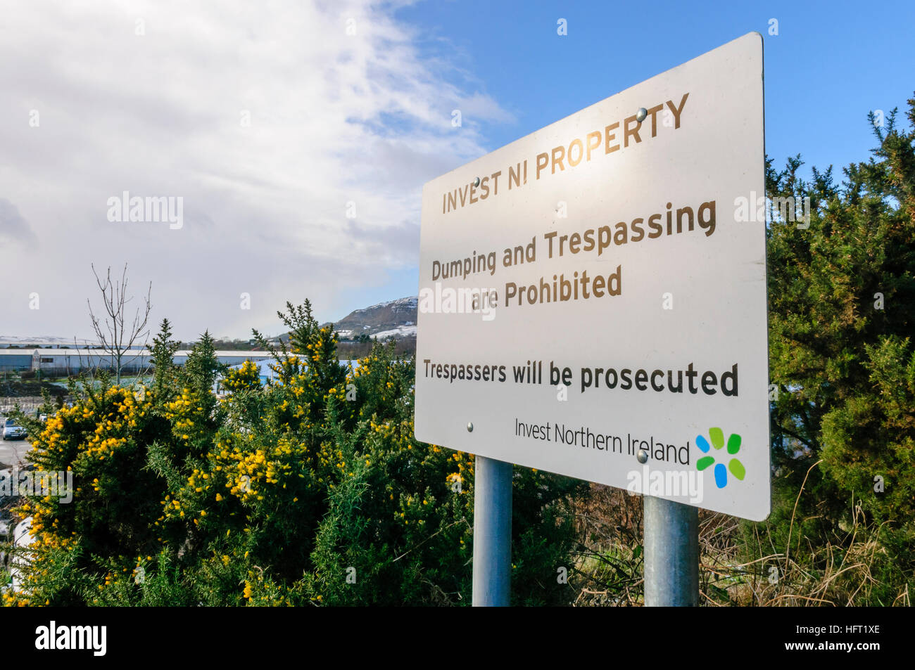 Sign at an Invest Northern Ireland site warning dumping and trespassing are prohibited. Stock Photo