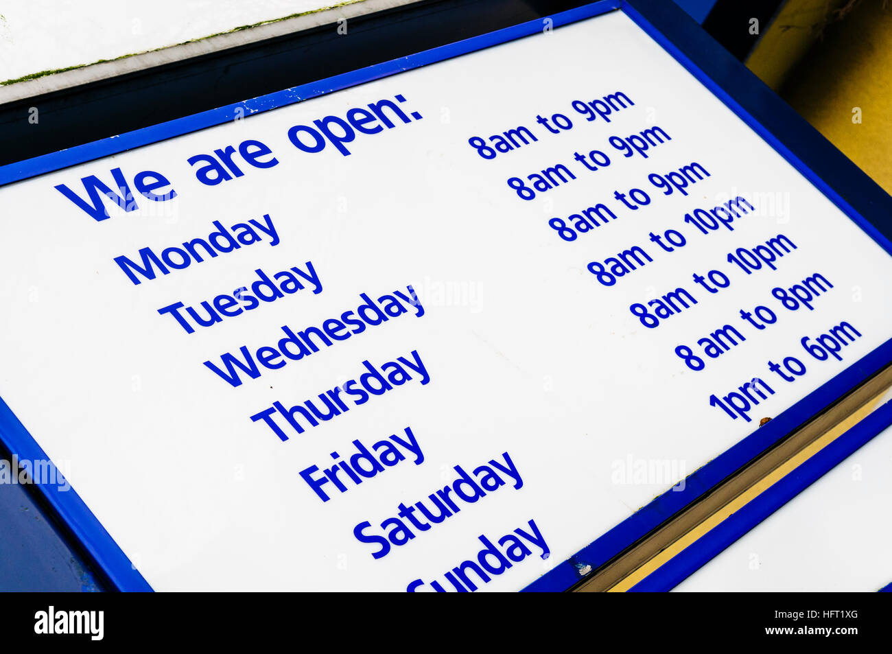 Opening hours at a supermarket Stock Photo