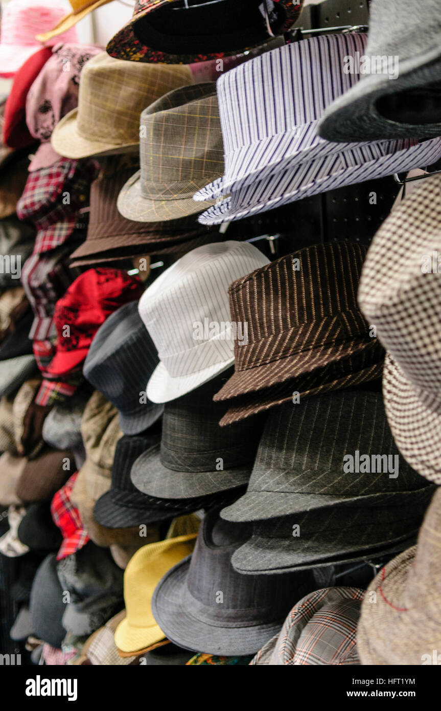 Lots of men's hats for sale in a shop. Stock Photo