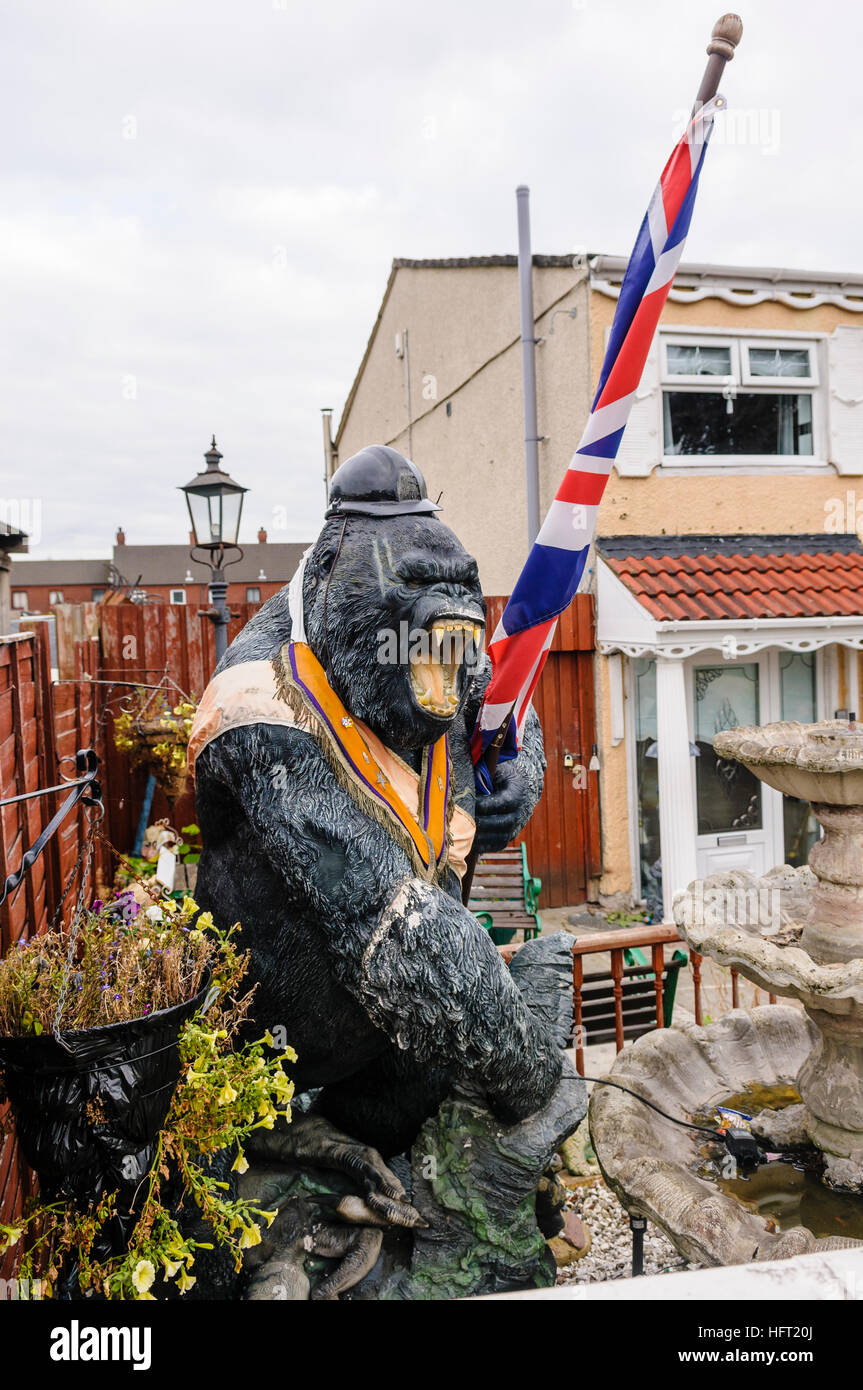 A fibreglass gorilla wears an orange sash and carries a union flag on the Shankill Estate, Belfast Stock Photo