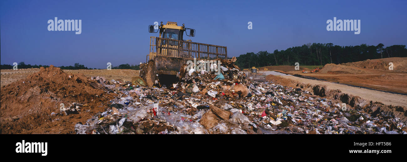 Heavy equipment at work in a sanitary landfill operation. Stock Photo