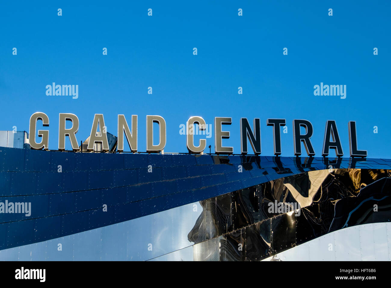 The Grand Central sign above the stainless steel clad facade of Birmingham New Street Railway Station Stock Photo