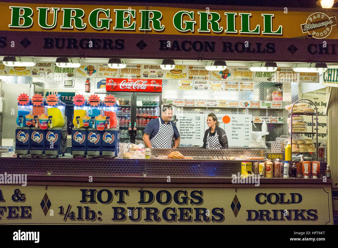 Couple working at a burger van Stock Photo