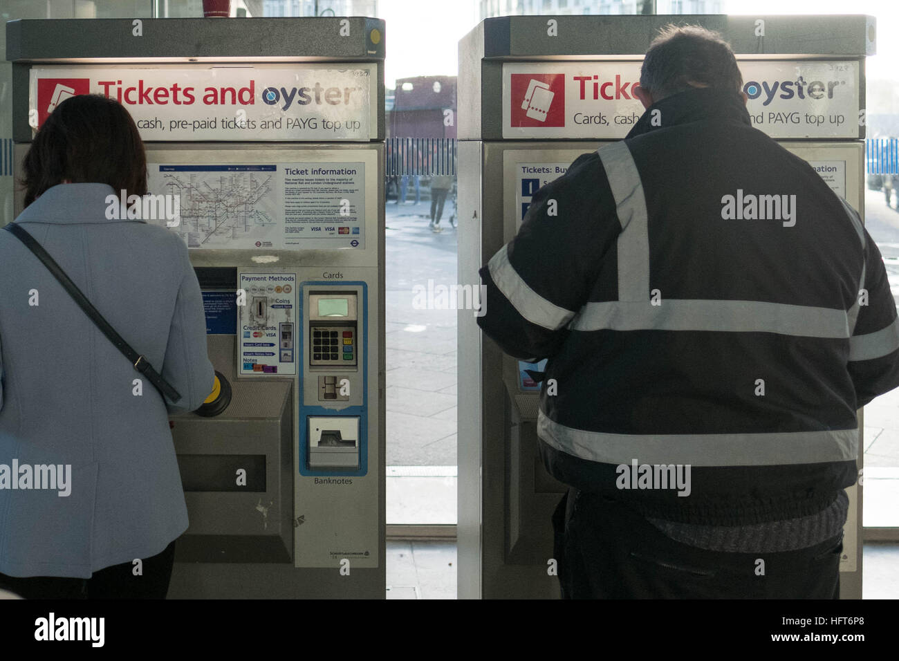 Passengers buy ticket at Stratford Railway Station in east London, as