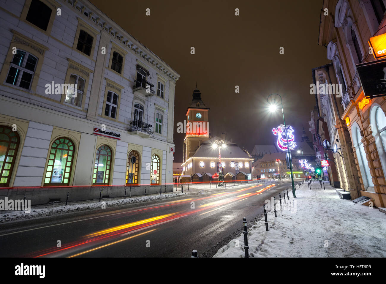 BRASOV, ROMANIA - 15 DECEMBER 2016: Brasov Council House night view decorated for Christmas and traditional winter market in the old town center Stock Photo