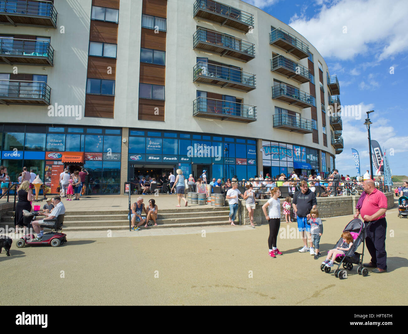 Tourists holiday makers The Sands North Bay Scarborough North Yorkshire Coast UK Stock Photo