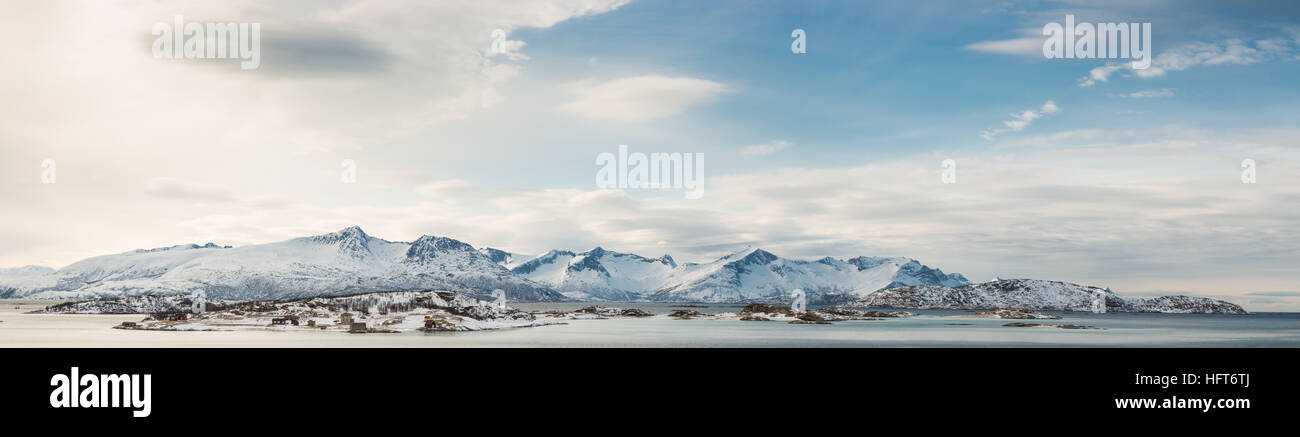 Panoramic view at fjord by the cold sea with snowy peaks in the ...