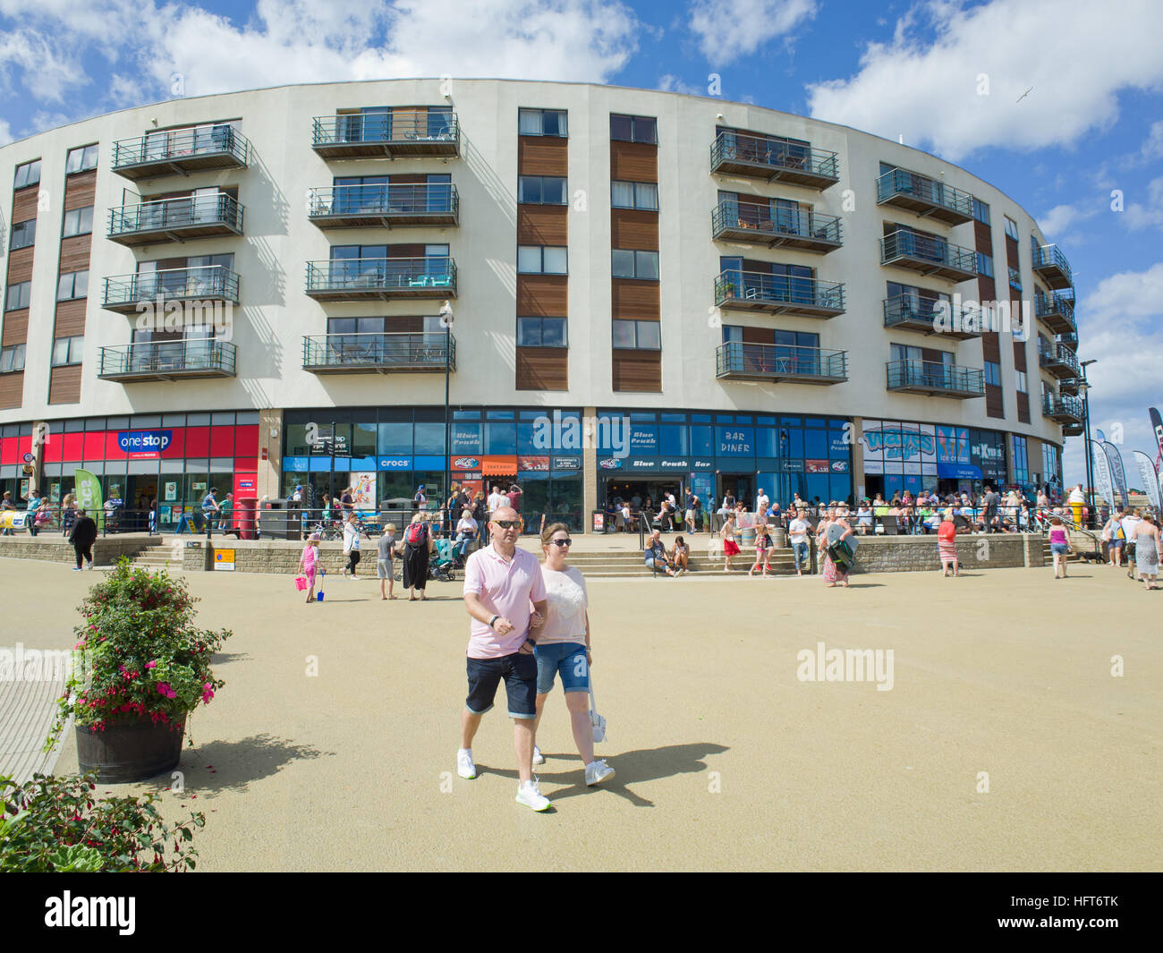 Tourists holiday makers The Sands North Bay Scarborough North Yorkshire Coast UK Stock Photo